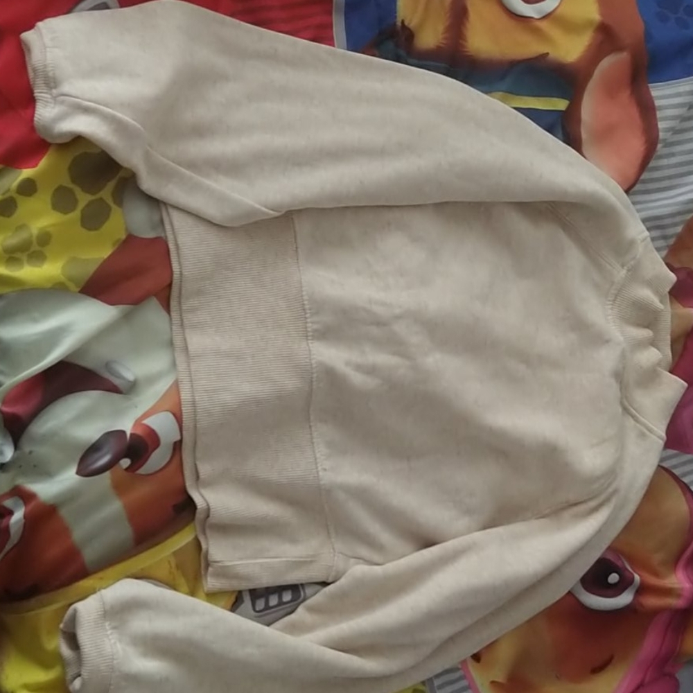 a tan colored long sleeved shirt